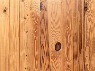 Pattern, texture of wooden slats, boards of red, golden, brown color. The background is made of wood. Industry and woodworking. Graphic material