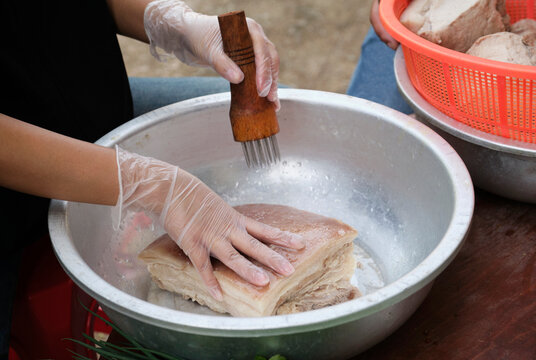Processing the crispy skin of pork belly,closeup