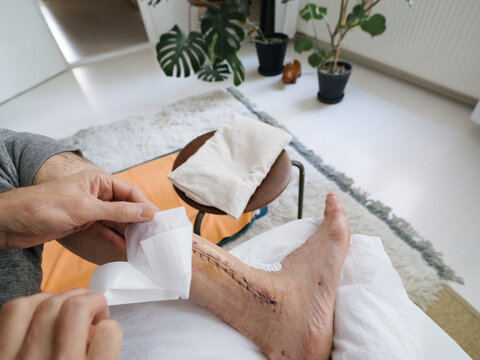 POV Man Dressing Sutures With Sterile Plaster