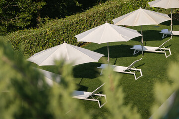 Relaxing spa oasis with sunbeds and umbrellas