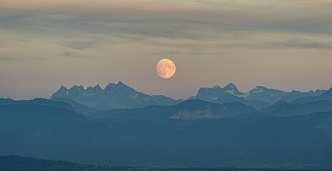 Moon rising over Dents du Midi in Valais, Switzerland