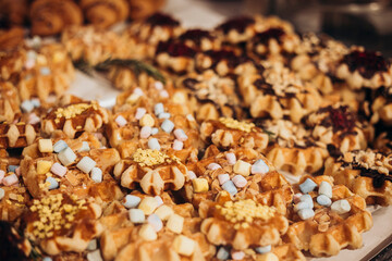 Colorful waffles and pastries in shop window display