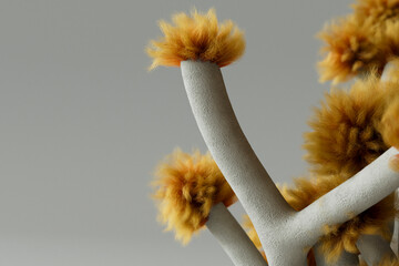 Detailed abstract tree-like sculpture with fuzzy orange accents