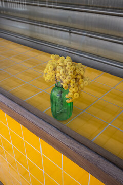 Yellow Flowers in Green Vase