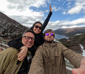 UGC Group Selfie in Ushuaia with Snowy Mountain View