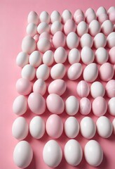 Pink and white Easter eggs arranged in rows over pink background, Easter, cheerful, vibrant