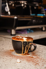 A steaming cup of cocoa pours gracefully as chocolate sprinkles cascade down, mixing warmth and gaze in every glance.