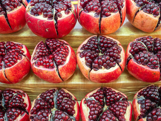 Pomegranate fruits pattern in nature background.