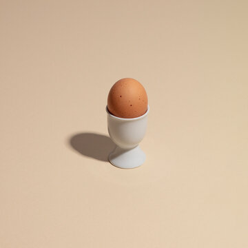 Brown Egg in White Egg Cup