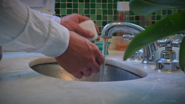 Washing hands
This close-up video shows a man meticulously washing his hands. The camera focuses on the detail of the soap lather, water, and the process of cleaning.
04.12.2024