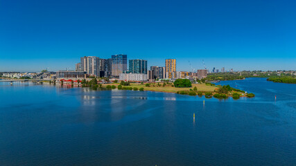 Obraz premium Panorama Aerial view above Rhodes with views to Meadowbank and Olympic park and Wentworth Point and Concord West with Parramatta River in Sydney NSW Australia