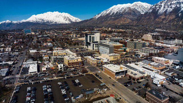 MARCH 2024, PROVO, UTAH - Provo Skyline and main street area is surrounded by snow capped Wasatch Mountains