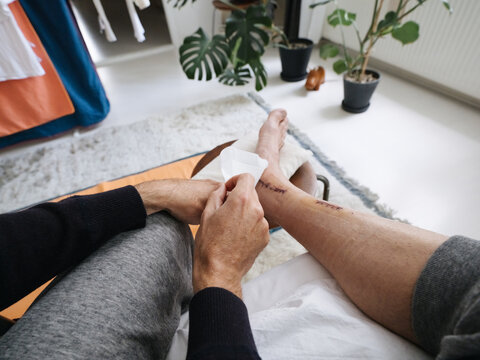 POV Man Dressing Surgical Sutures With Sterile Plaster