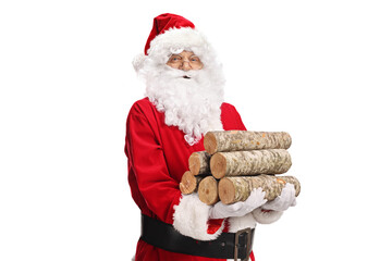 Santa claus holding a pile of firewood