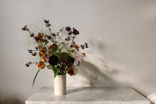 Beautiful floral arrangement on marble table