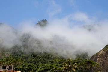 Fototapeta premium Low Clouds Passing Between the Mountains 