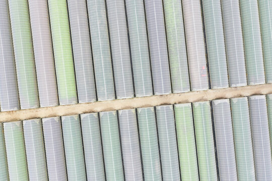 Aerial Drone Shot of Modern Commercial Greenhouse Agriculture.