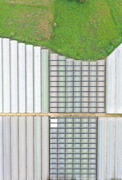 Aerial View of Massive Greenhouse Complex Revolutionizing Agricu