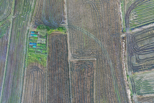 Aerial View of Intricate Crop Patterns and Modern Farming Techni