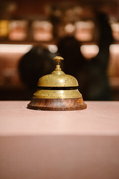 vintage brass bell creates nostalgic charm on a cafe counter.
