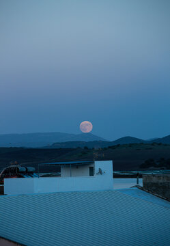Hunters full moon over mountains. 