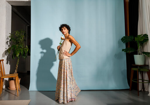 A graceful model poses in a floral skirt 