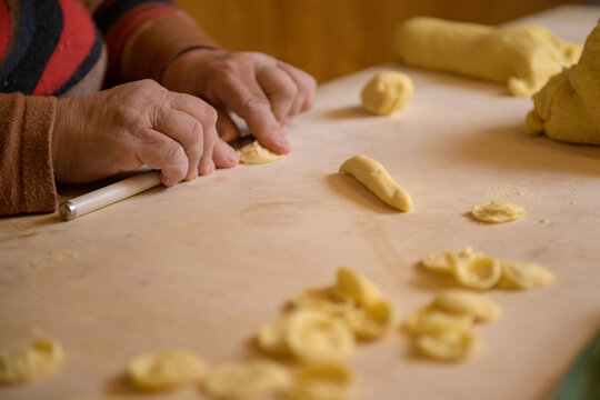 Female hans making apulian pasta orecchiette