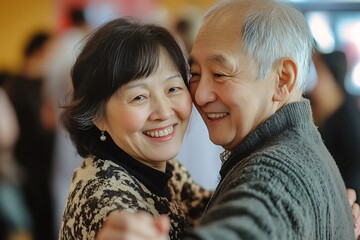 Happy elderly asian couple dancing together and smiling