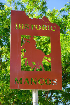 Mancos, CO, USA - June 16, 2024; Artistic sign for Historic Mancos town in Colorado