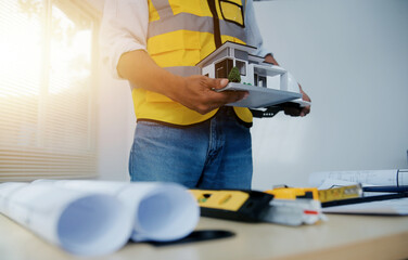 Image of engineer meeting for architectural project. working with partner and engineering tools on workplace vintage tone.