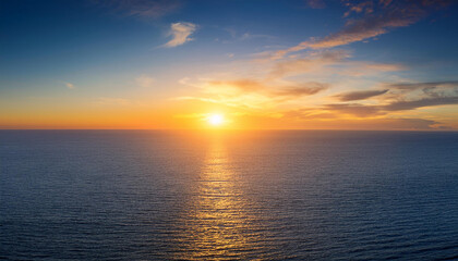 Fototapeta premium Beautiful sunset over a wide open ocean or sea