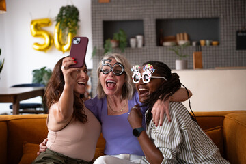Cheerful women celebrating  birthday at home