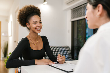 Smiling Client Signing Spa Form