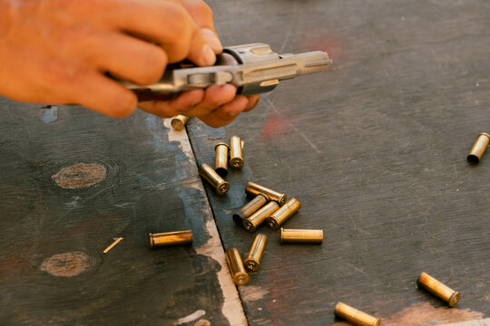 African man Shooting guns at gun range