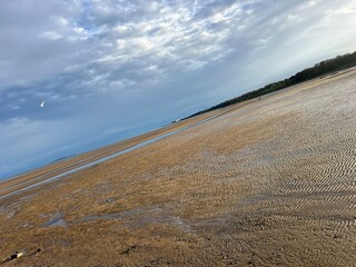 water is gone from beach on low tide time
