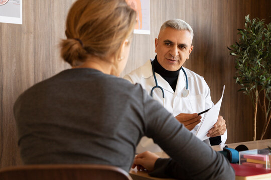 Doctor explaining medical test results to patient in office
