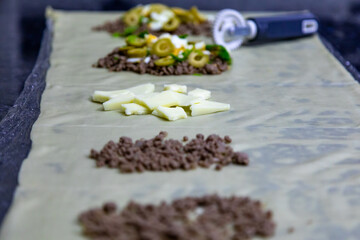 Traditional Brazilian fried pastry stuffed with ground beef. 