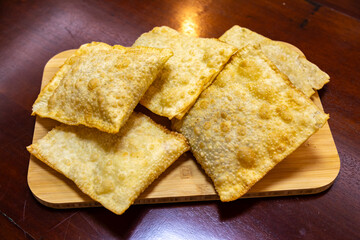 Traditional Brazilian fried pastry stuffed with ground beef. 