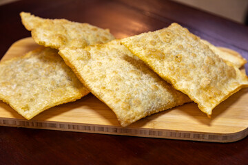 Traditional Brazilian fried pastry stuffed with ground beef. 
