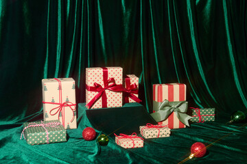 Festive Christmas Presents Displayed on Green Velvet Background