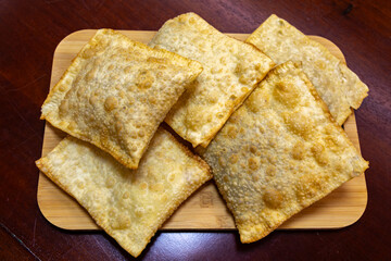 Traditional Brazilian fried pastry stuffed with ground beef. 