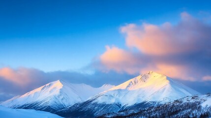 Snow-capped mountains under a vibrant sky at sunset.