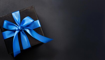 Black Gift Box with Blue Ribbon on Black Background. Top View of Brotherhood Day Gifts with Copy Space