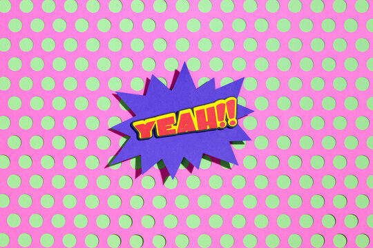 Colorful Pop Art Style 'Yeah!!' Text on Polka Dot Background