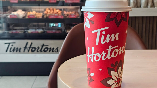 Mexico State, Mexico - Dec 20 2023: Red glasses with drinks in the cafeteria of the Canadian chain Tim Hortons in Mexico State during the Christmas season