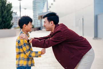 Father Advising and Teaching His Son in a Warm Moment Outdoors