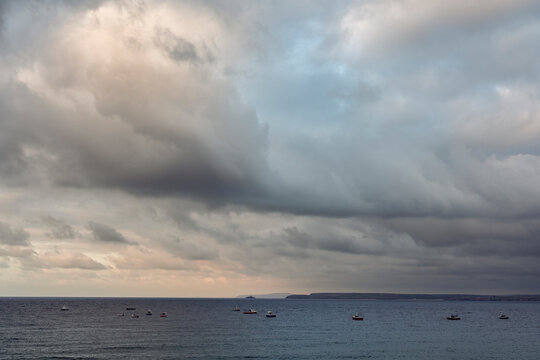 Fishing boats in evening light near St Ives.