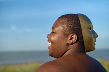 A joyful reflection at the beach under a blue sky