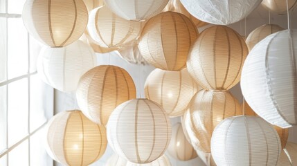Beige and white paper lanterns hanging from the ceiling, creating a soft, warm ambiance.