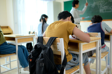 A schoolchild with his rucksack to store vital stuff for class